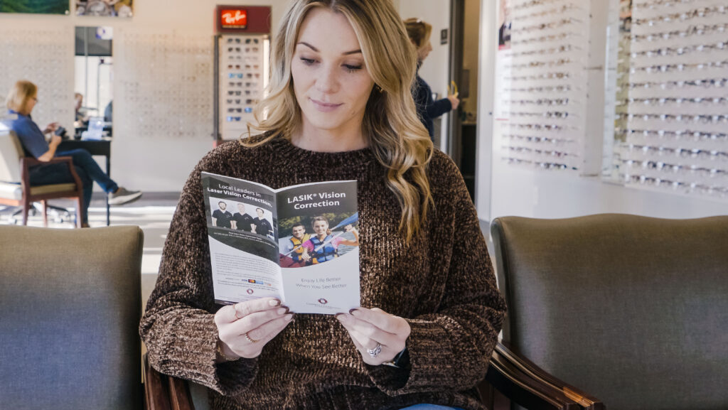 woman reading about lasik